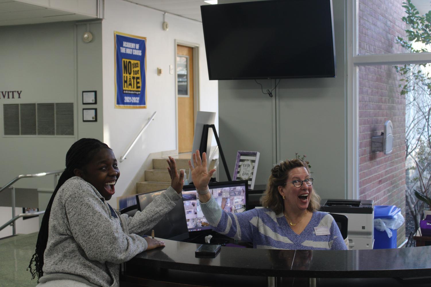 Mrs. Enright and Rose Kontchou '23 having a blast chatting at the front desk.