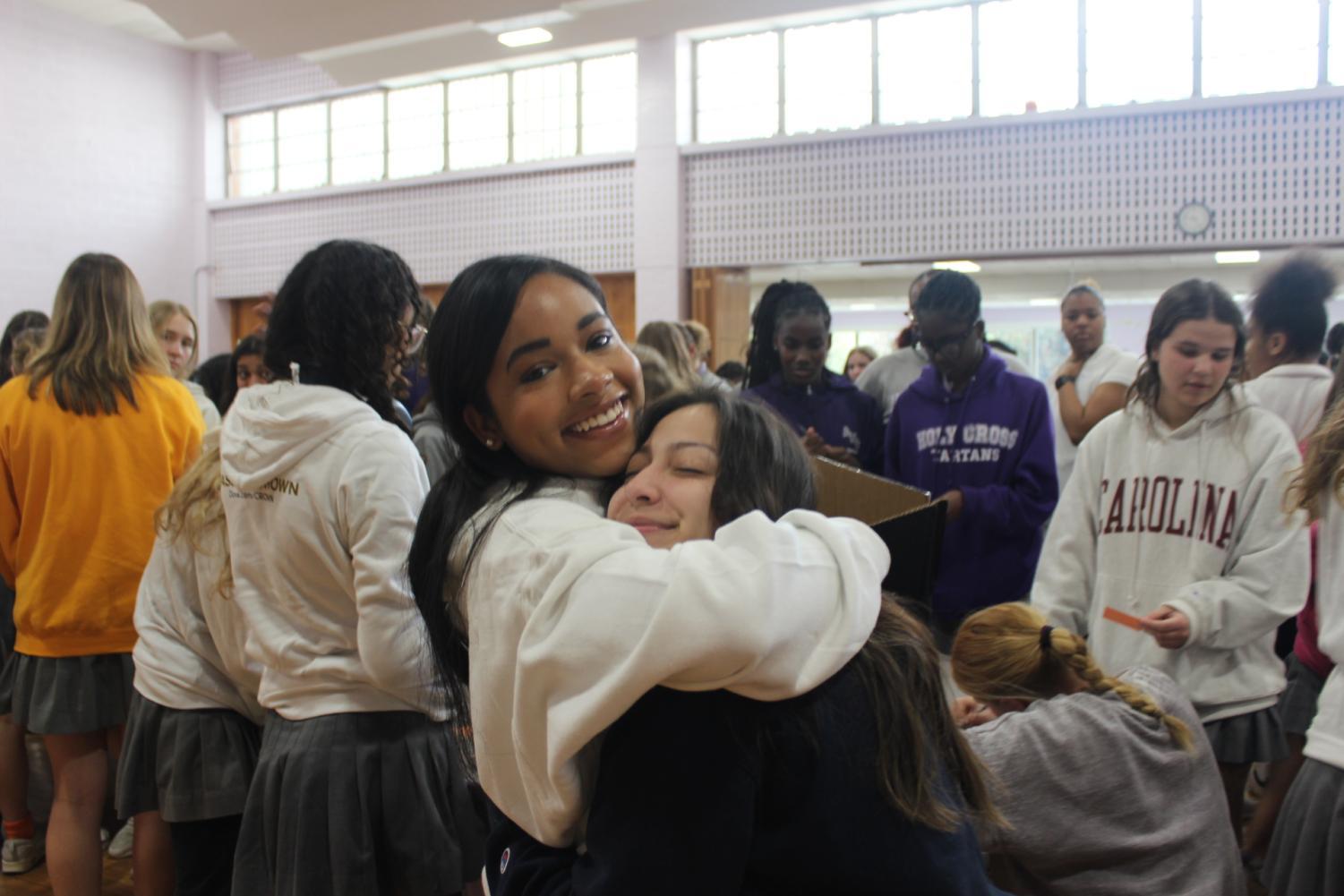 Grace Bryant and Ale DeGroat sharing a hug.