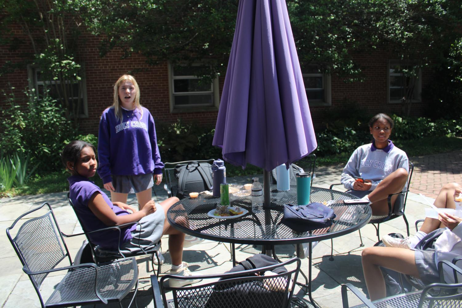 Juniors Angel Bryant, Adore Bryant, and Taylor Stone enjoy some end of the year privileges, such as the senior courtyard.