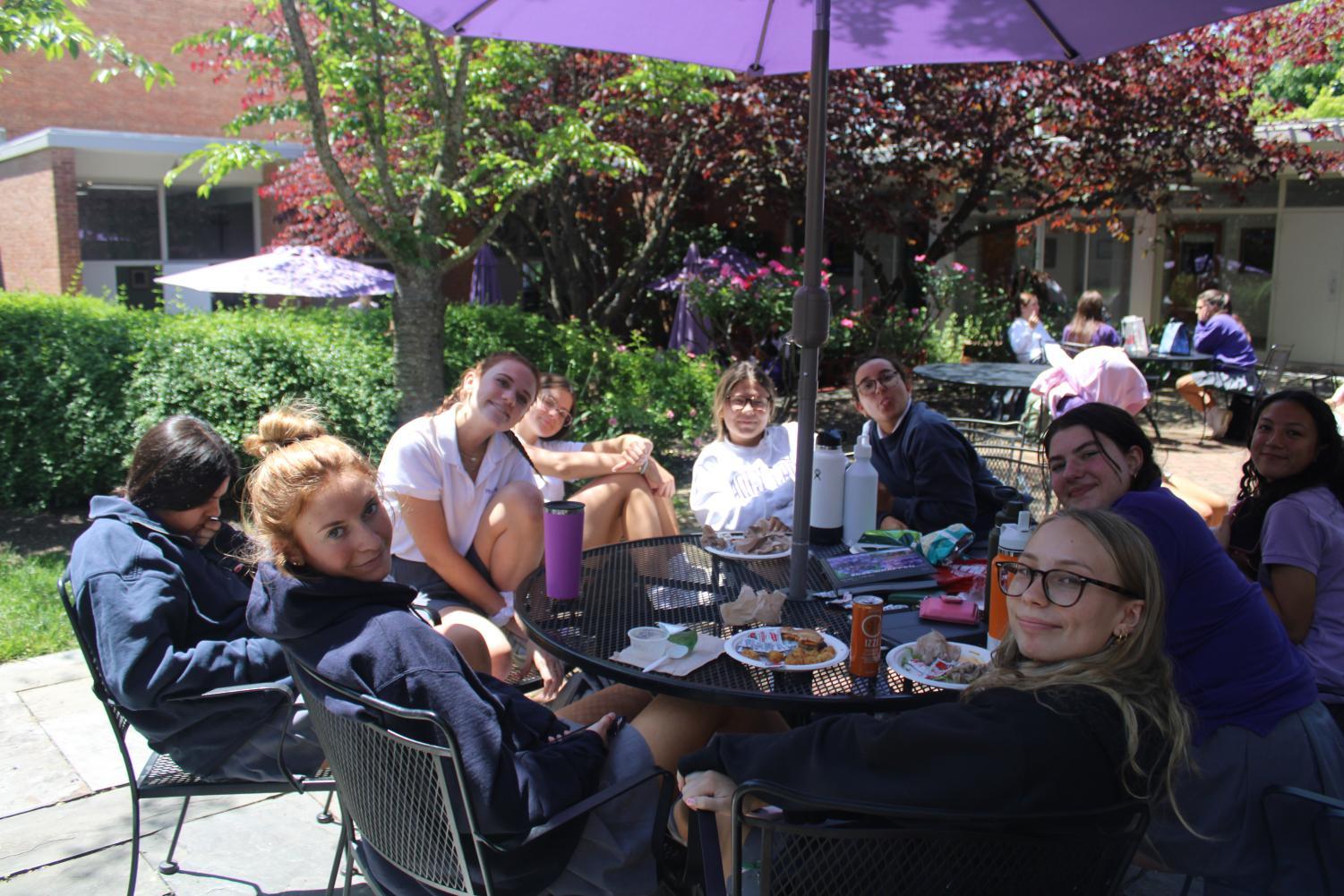 Juniors embrace the newly available senior courtyard, and soak up some sun before finals week.