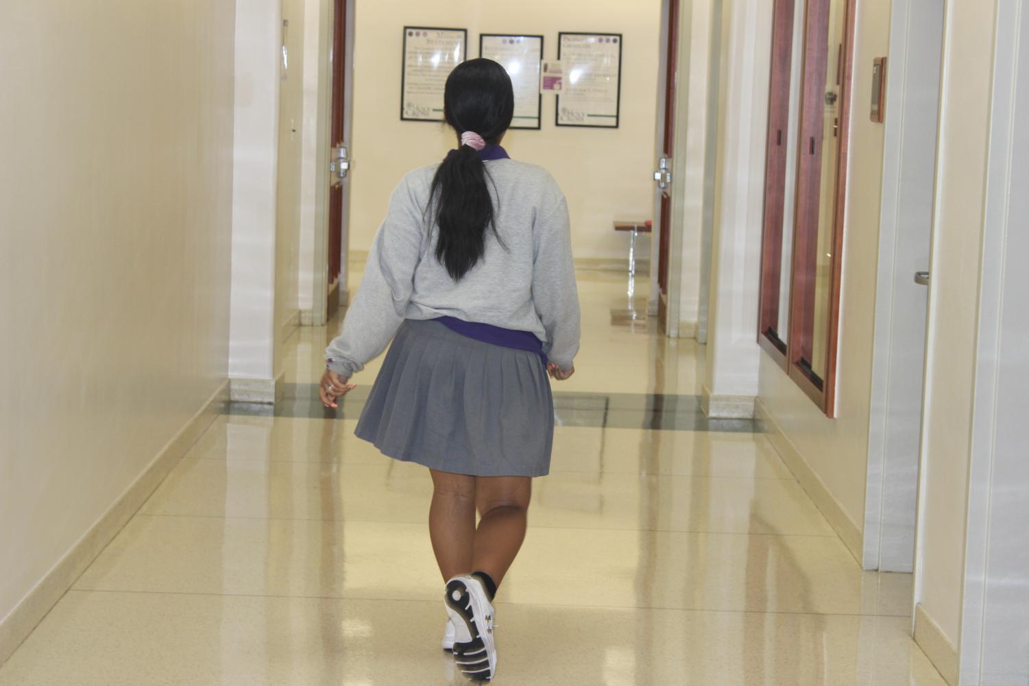 junior Grace Bryant walking to class.