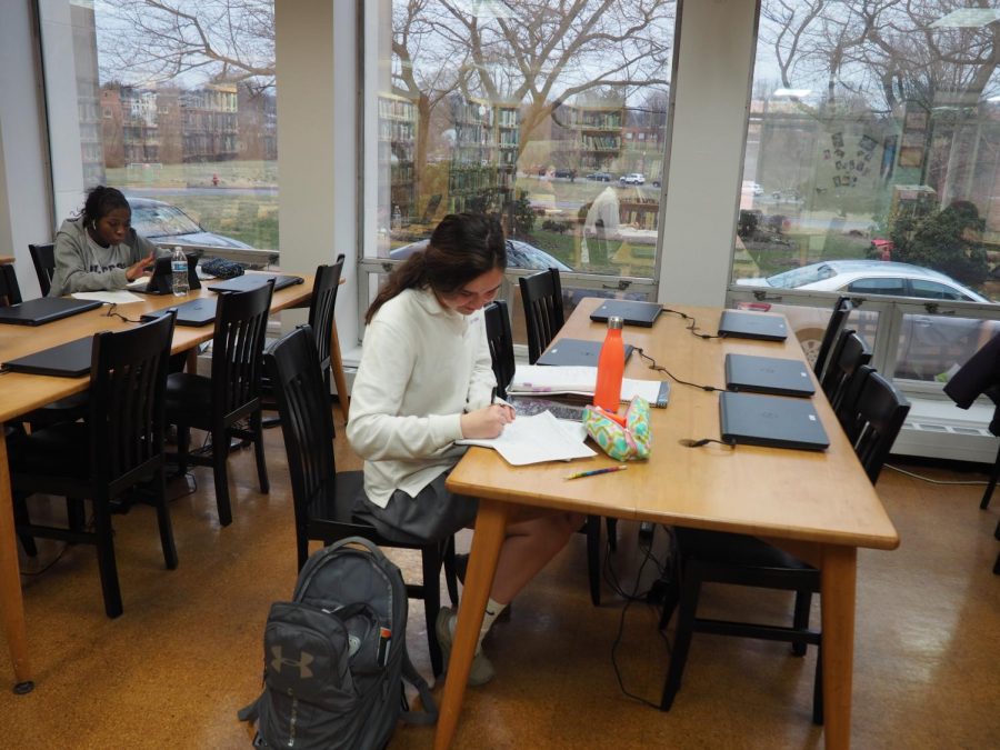 Freshman Kat Tylor studying in the library. 