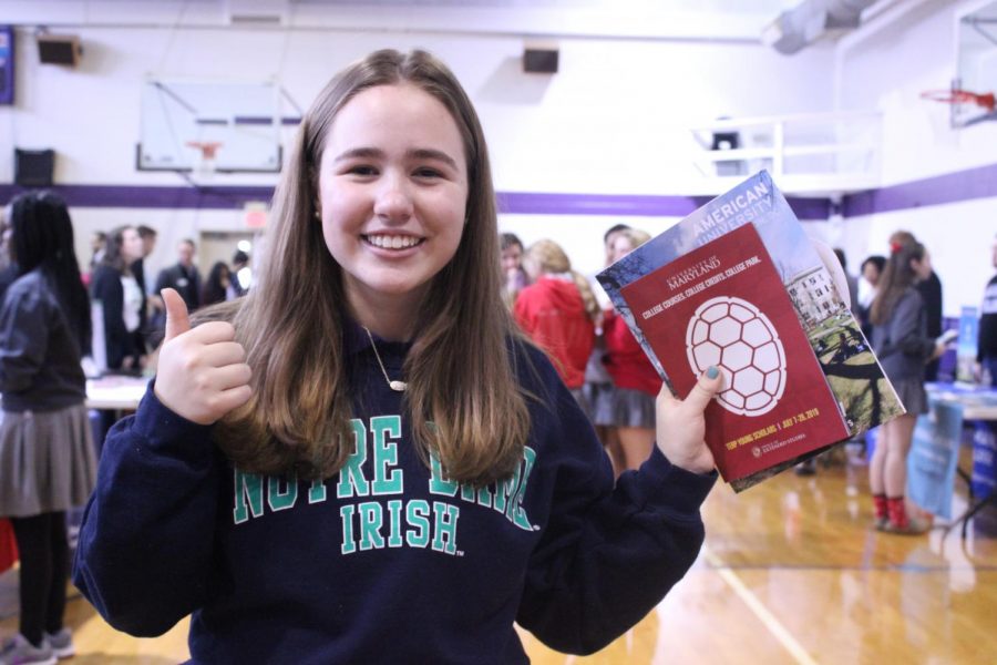 Junior Brooke Andrews collects brochures at the college fair.