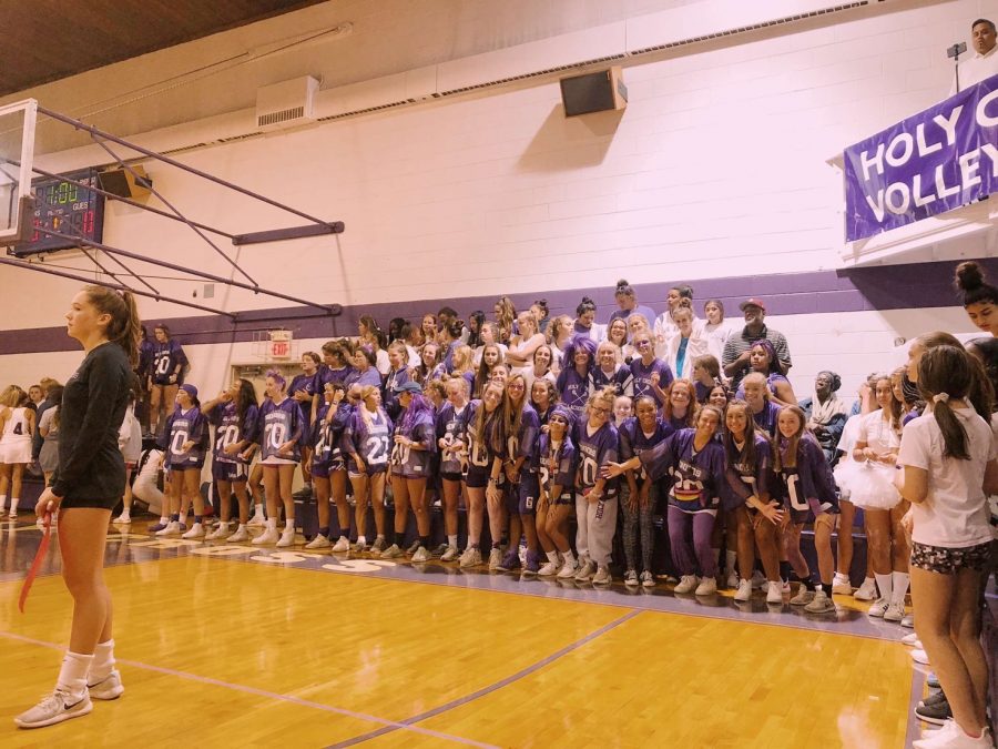 Tartan Booster Club cheering on the volleyball team against GC rivals. 