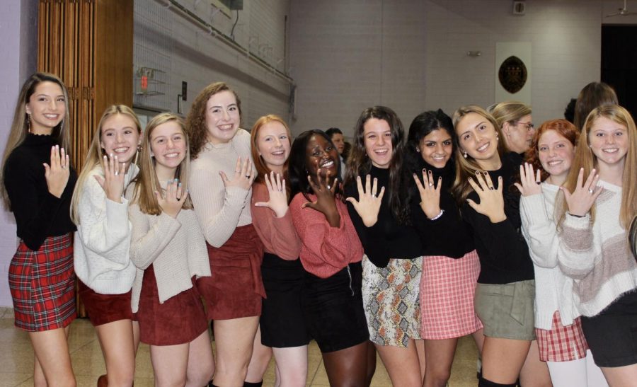 Juniors showing off their new class rings