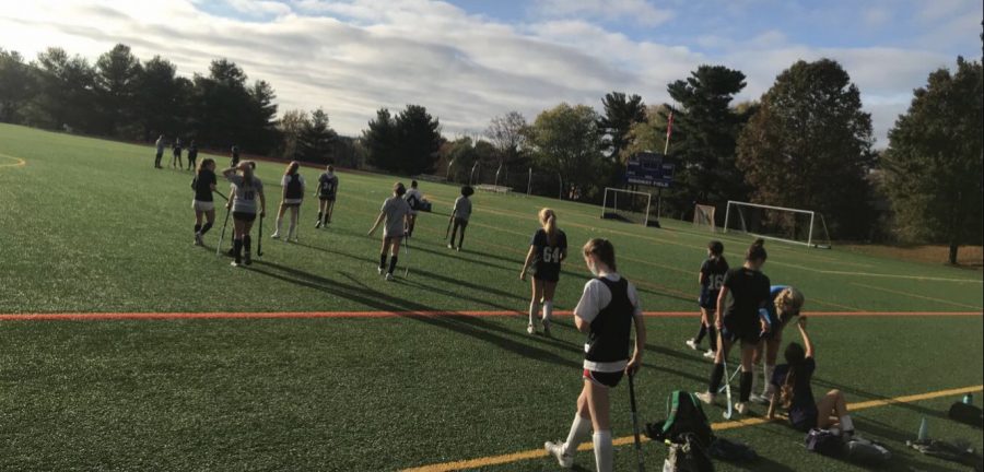 Field Hockey team practices safely.