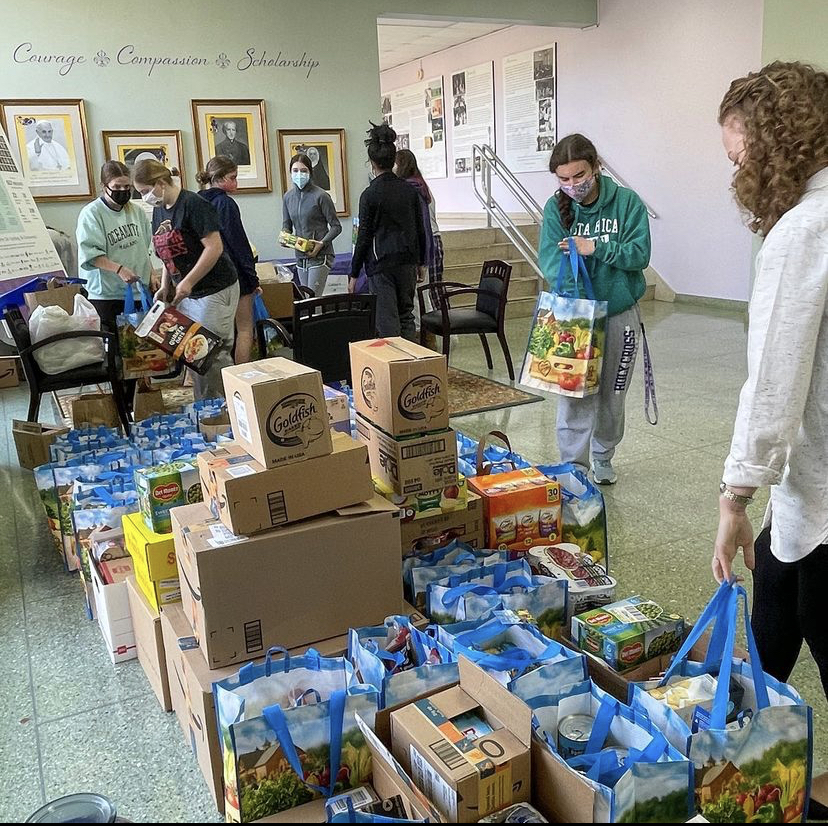 Students organizing bags of food