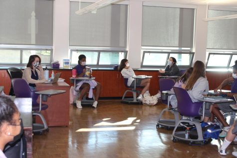 students sitting and working in classn