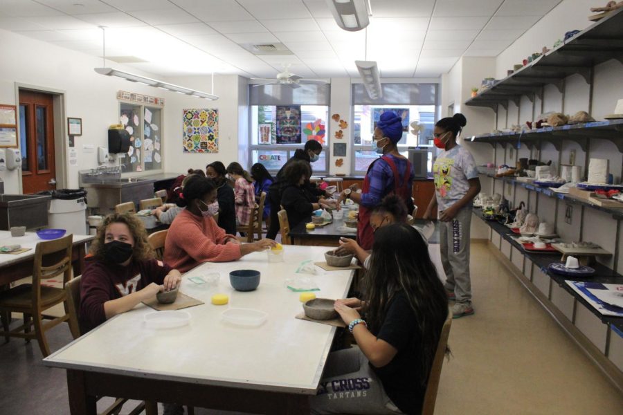 Students in an art class making bowls for Holy Cross Gives Thanks