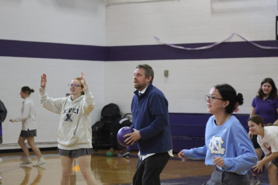 Grace Kelley, Sarah Owens, and Mr. Christian rallying together to win the game. 