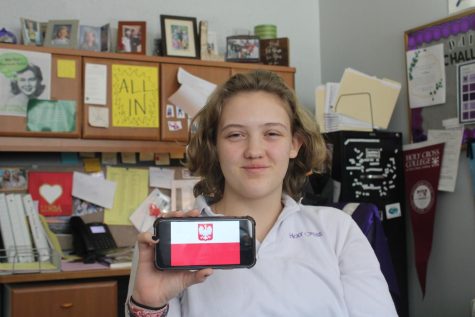Junior Zosia Dobosz holding a Polish flag.