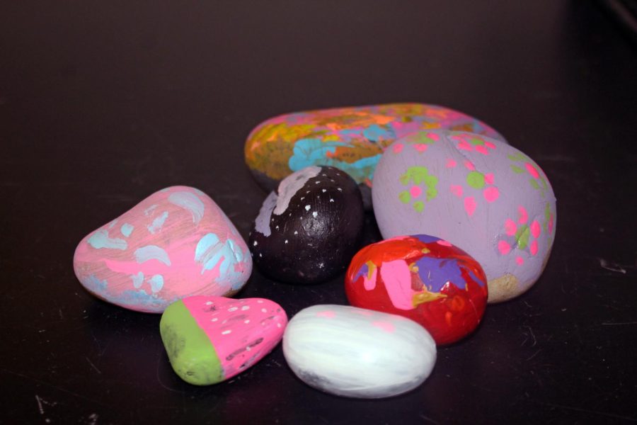 Colorfully painted and decorated rocks.