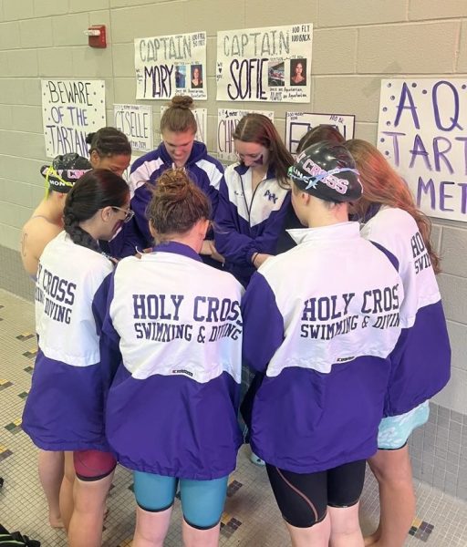 The swim team prayer before the Metros meet at Germantown Aquatic Center. They are ready to swim fast and make achieve best times.