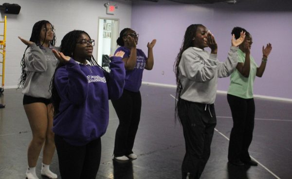 Some members of the Holy Cross Step Team, Jada Balkcon, Hannah Wilson, DeAirra Williams, Keira Chestnut, and Omachi Ijoma practicing their choreography in the Holy Cross dance studio during fall 2023. The team was rehearsing for one of their performances and made sure that they put their best foot forward, even at practices.