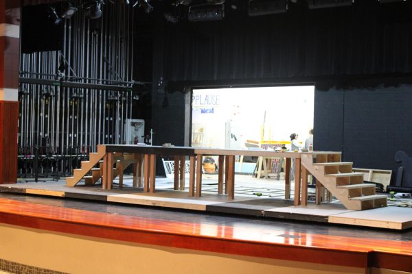 The set for the musical being built on the stage