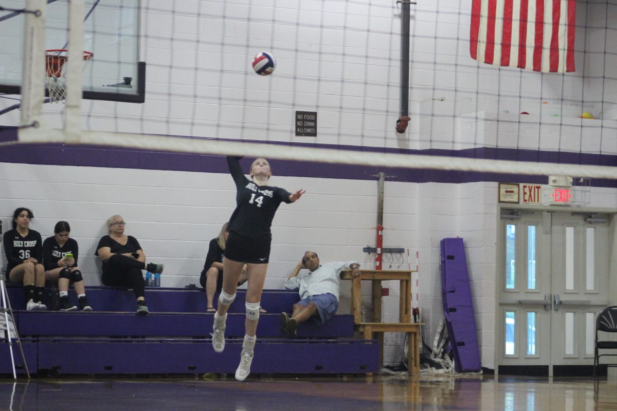 Emerson+Sellman%2C+varsity+volleyball+captain%2C+outside+hitter%2C+and+an+All+American+Under-Armour+Volleyball+player%2C+serving+in+a+game+at+Holy+Cross.