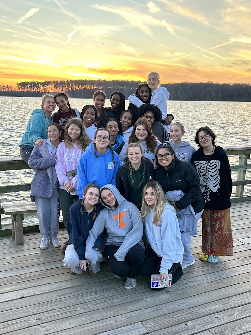 Senior+retreatants+and+student+leaders+enjoy+the+sunset+on+the+last+night+of+Kairos.+Participants+spent+three+nights+at+Camp+Wabanna+embracing+the+spirit+of+the+retreat.+