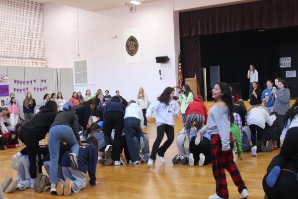 A group of teenagers running around.