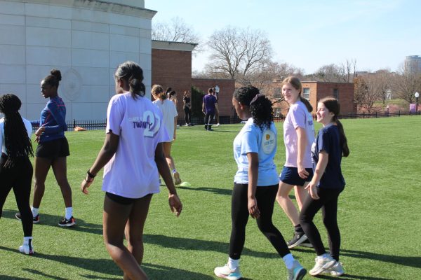 Freshmen short sprinters Cecelia Zarrelli, Daniella Quartey, Salome Nyangaya, and Blythe Batchelder  walking back to the end of the field to continue practicing for upcoming track meets. 