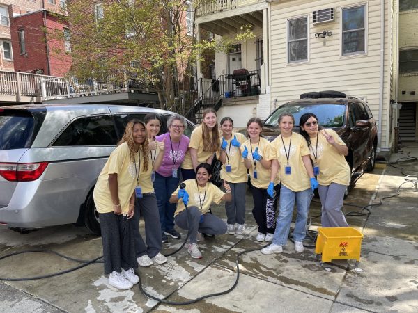 A day of service group sent to LArche community in Washington, D.C. Among other jobs, the students washed the cars used to take the residents to appointments.
